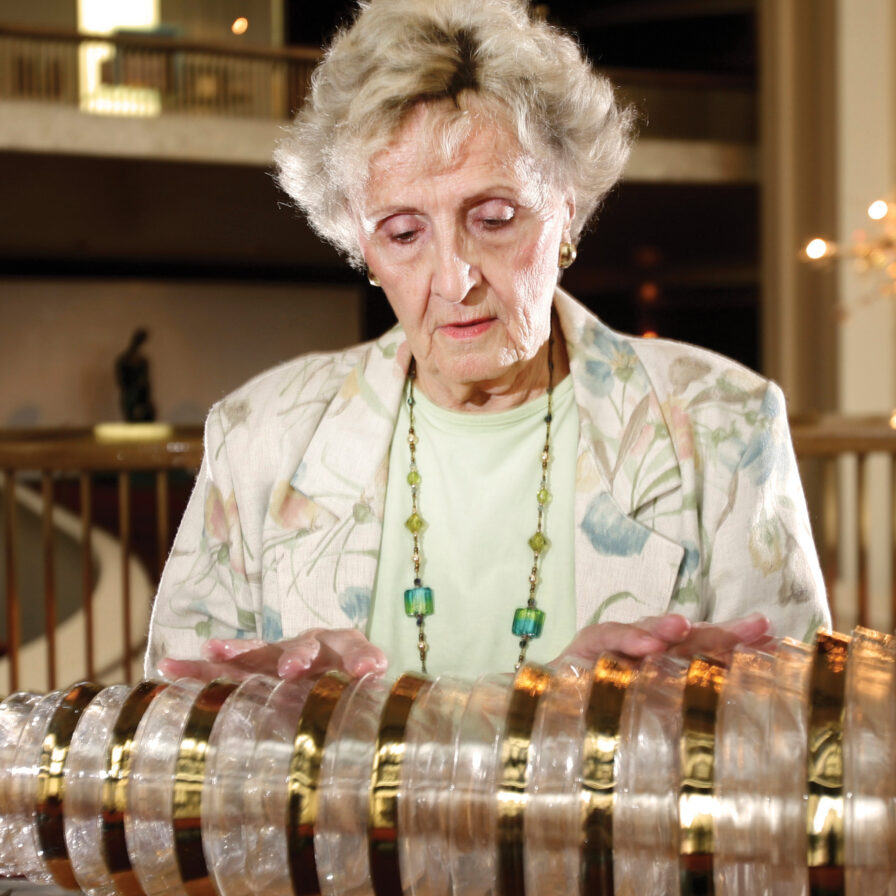 Cecilia Brauer playing the armonica, an instrument composed of a series of glass bowls, at the rotunda of The Metropolitan Opera House at Lincoln Center, in 2007.